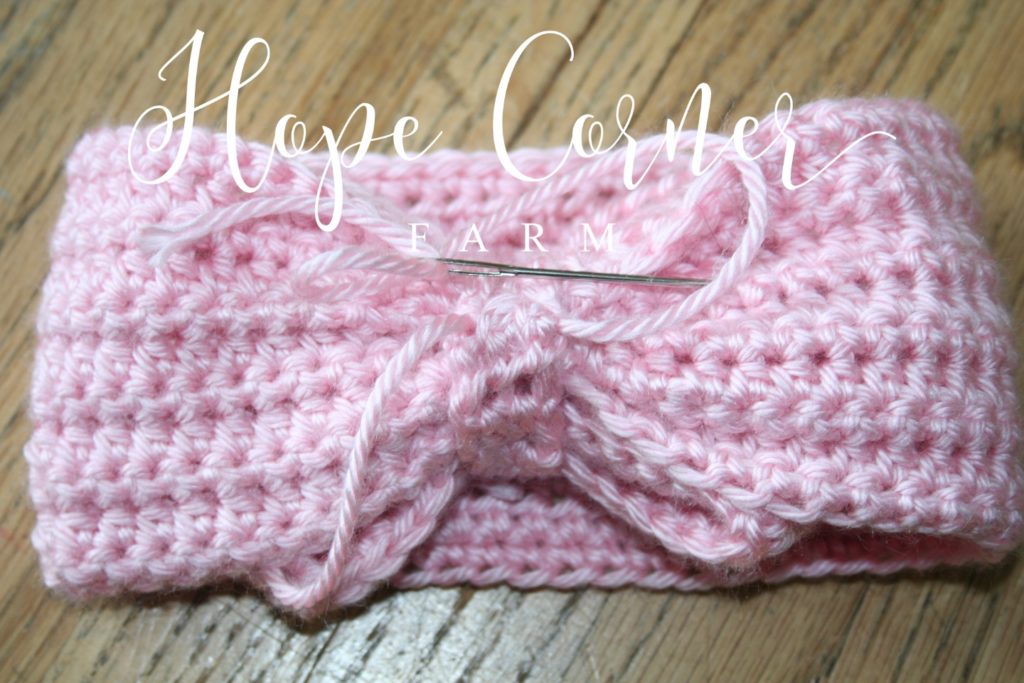 Weaving in the yarn crochet bow headband Hope Corner Farm