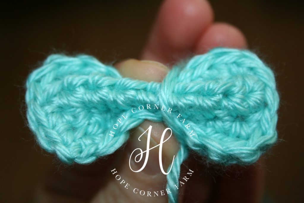 Crochet Mini Bow wrapping the tails around the middle Hope Corner Farm