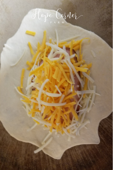 Final cheese layer Calzone recipe Hope Corner Farm