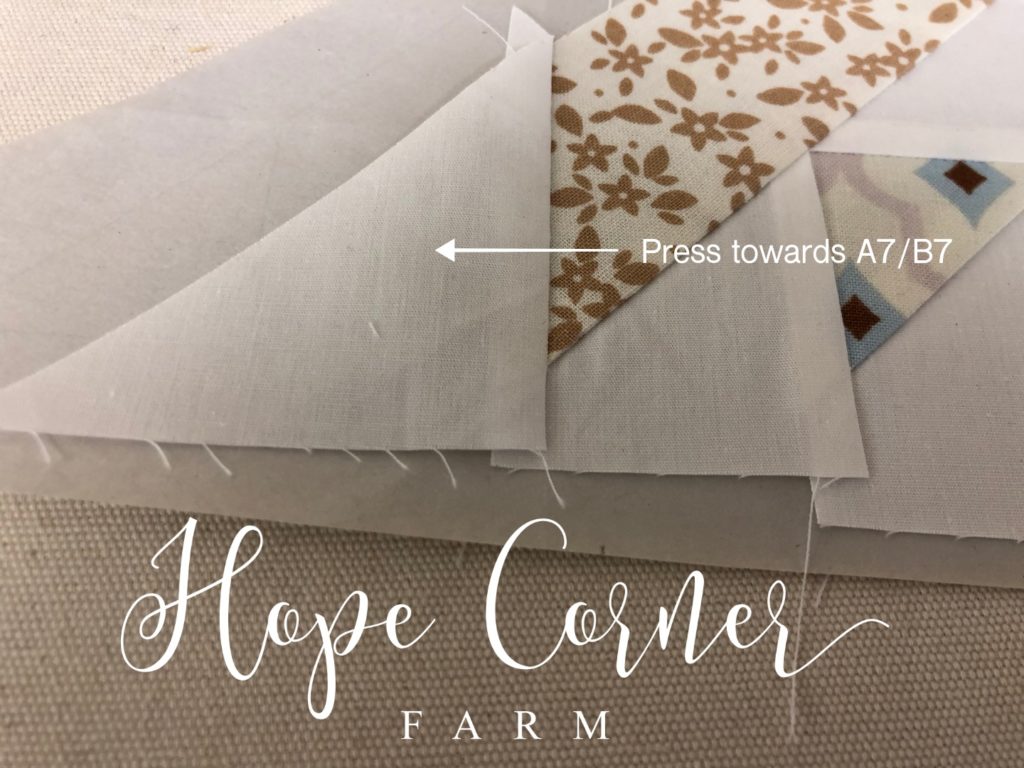 Pressing the seam in paper piecing Hope Corner Farm