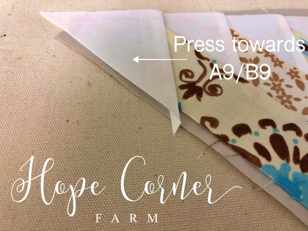 Pressing the seam in paper piecing Hope Corner Farm