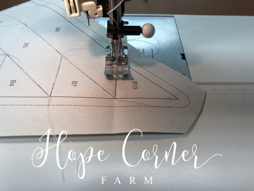 Sewing the final seam in paper piecing Hope Corner Farm
