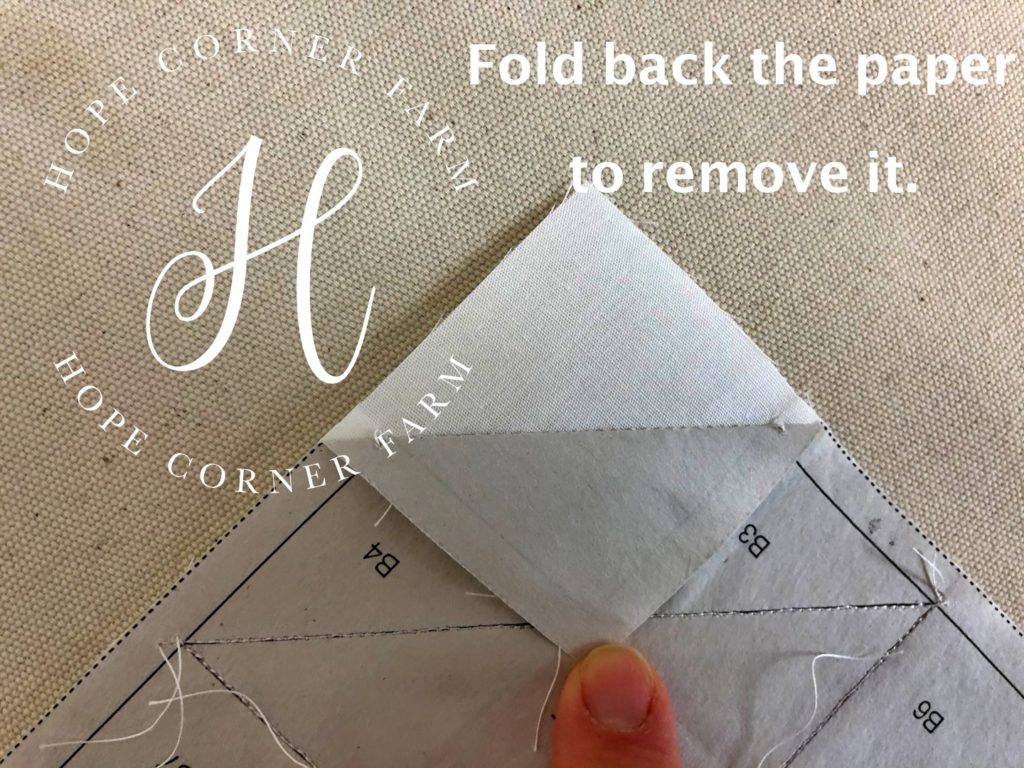Preparing to remove the paper backing after paper piecing Hope Corner Farm