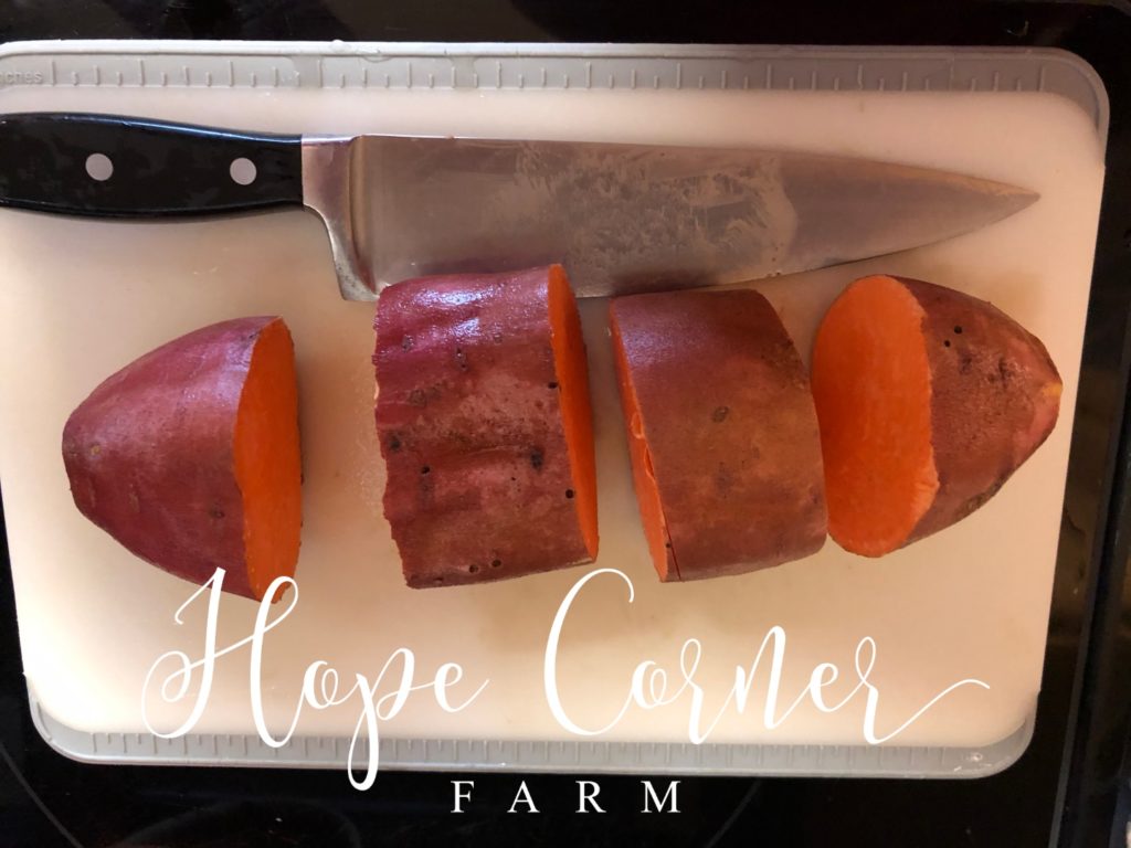 Cutting the sweet potatoes/yams into chunks Hope Corner Farm