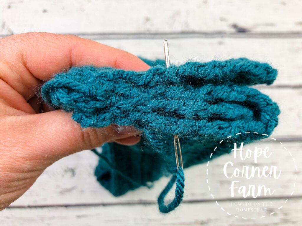 sewing the seam on the crochet headband