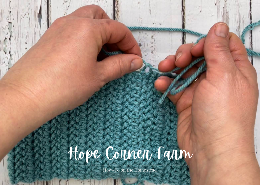 Tying a knot in the crochet headband