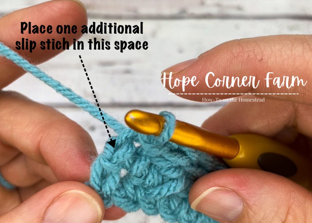 Picking up a crochet stitch in the free crochet ear warmer pattern