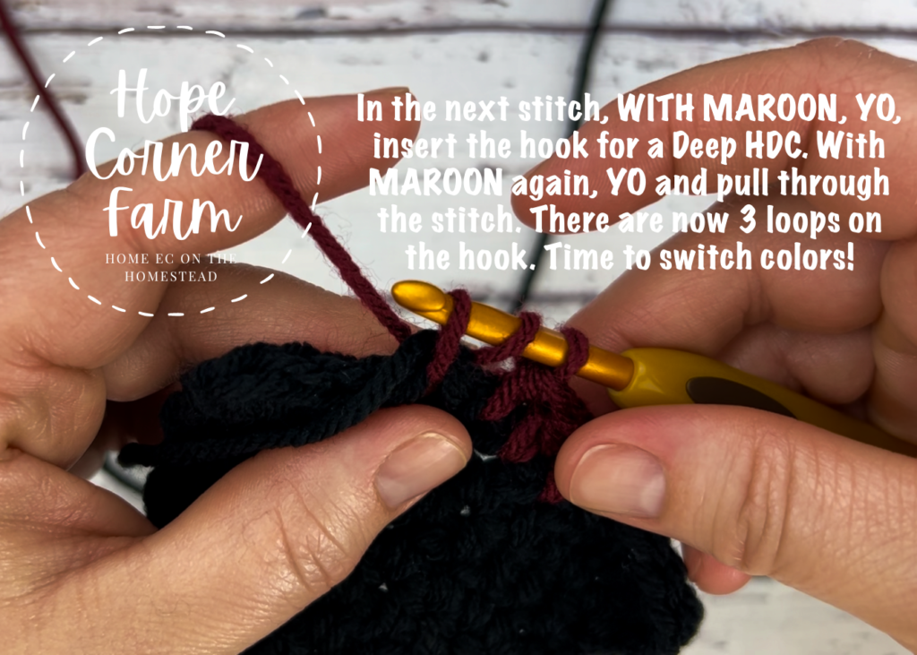 Changing to black yarn in the crochet buffalo plaid flower headband by Hope Corner Farm