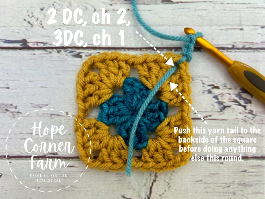 move the yarn tail to the back of the square