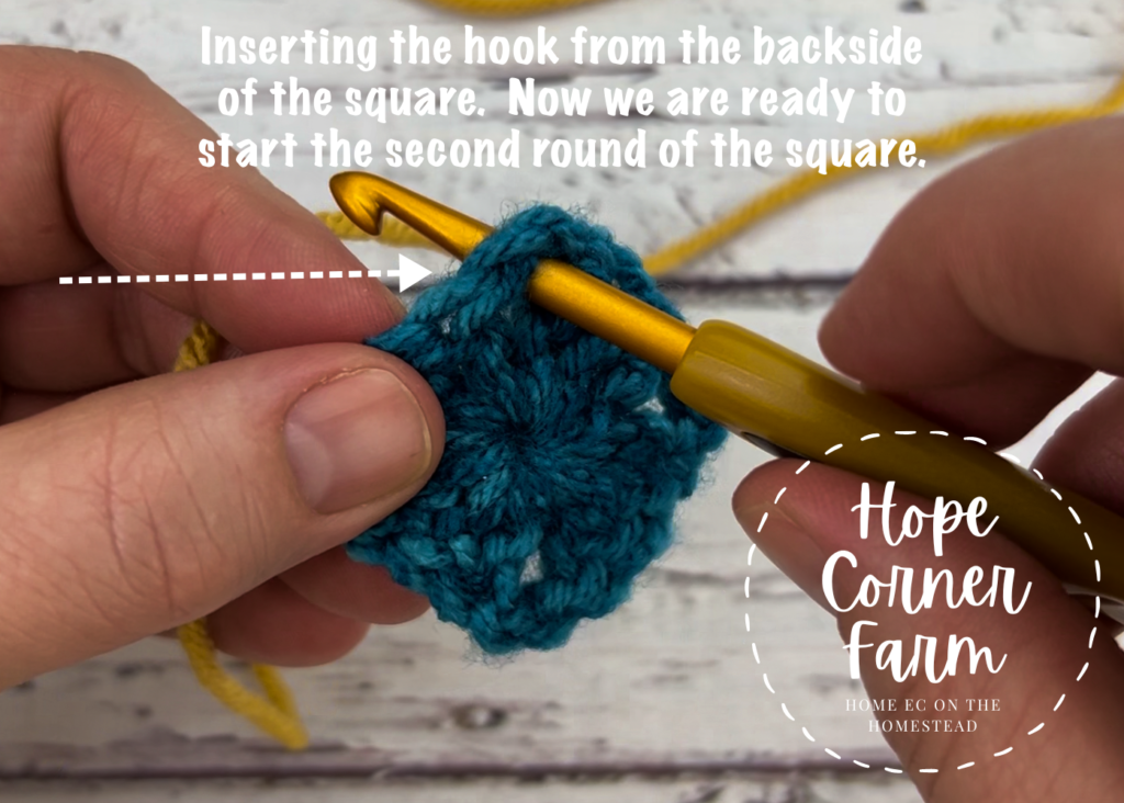 Inserting the crochet hook from the backside of the square