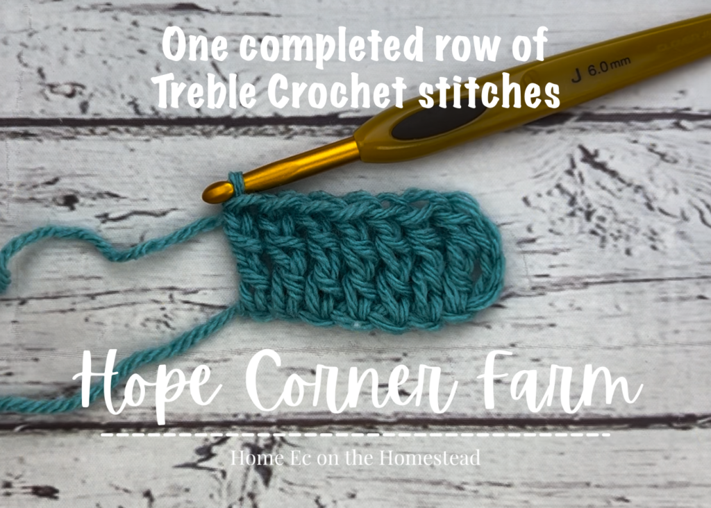 One completed row of treble crochet stitches