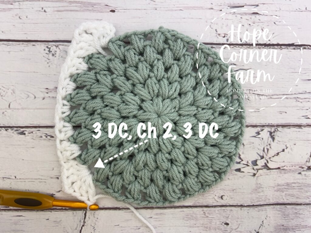 2nd corner created in the crochet puff stitch granny square