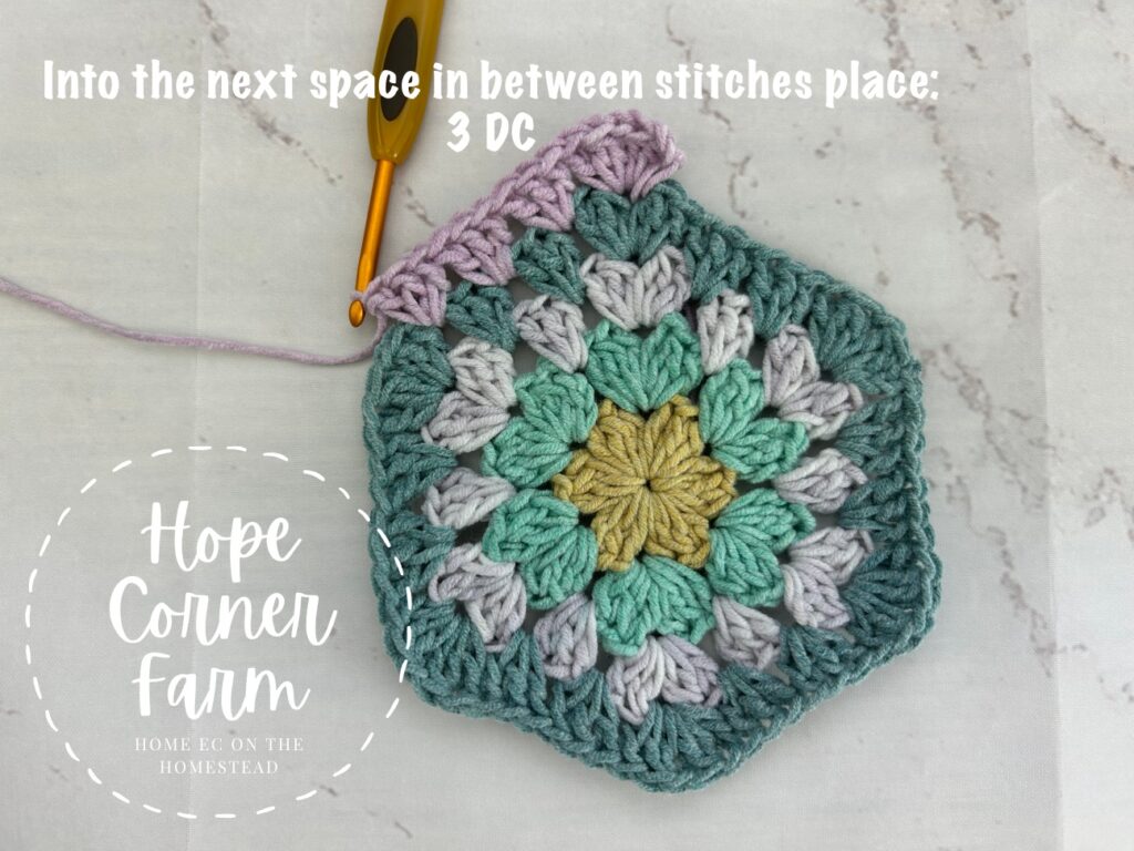 crocheting the first side of the granny hexagon