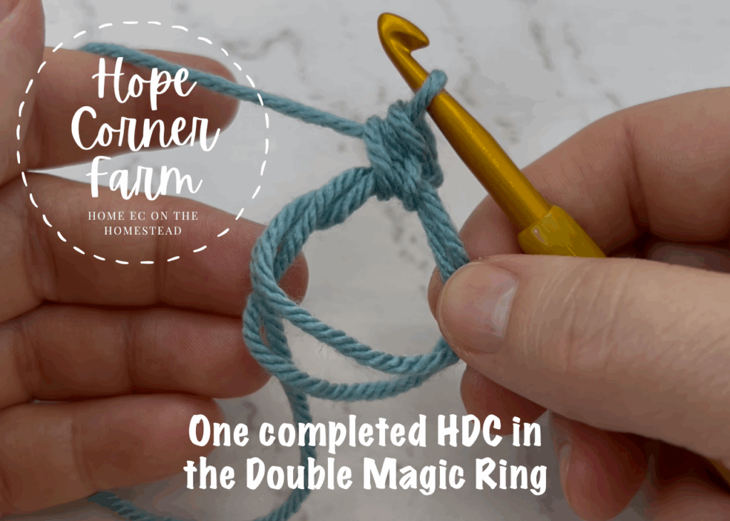 One completed half double crochet in the double magic circle