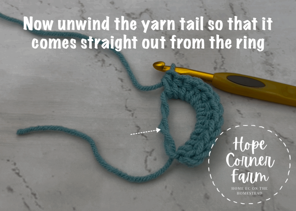 Unwind the yarn tail so that it comes straight out from the crochet magic ring