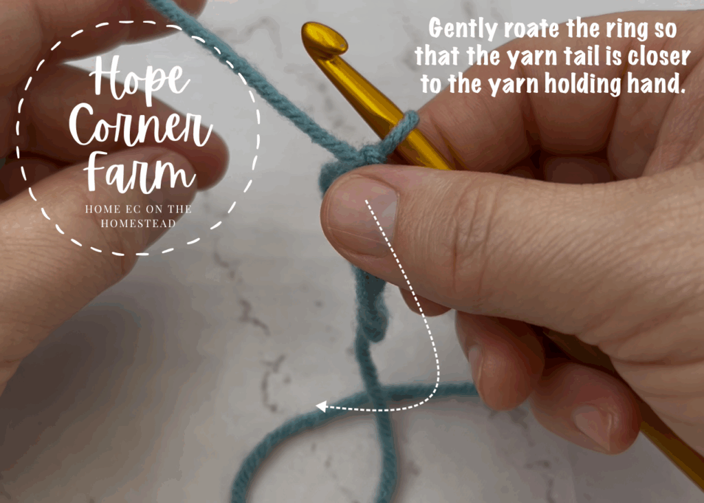 Gently rotate the ring so that the yarn tail is closer to the yarn holding hand