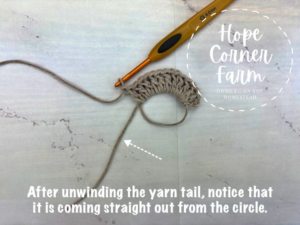 After udnwinding the yarn tail, notice that it is coming straight out from the circle.